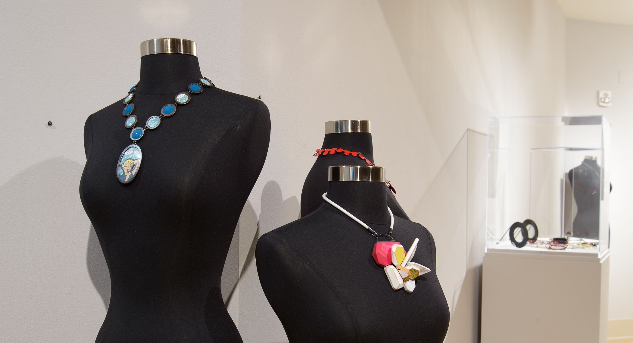 Color Me This: Contemporary Art Jewelry in the Mezzanine Gallery.