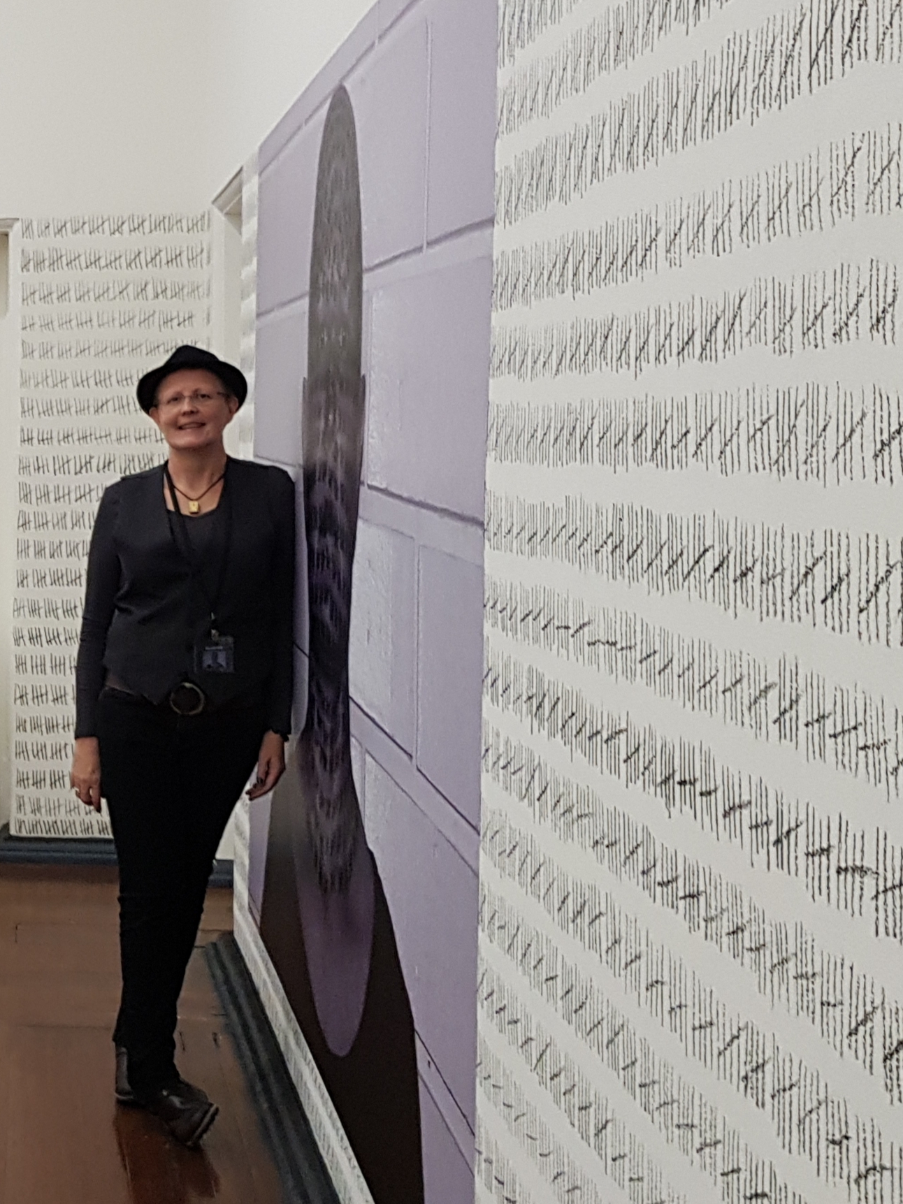 Jodi Woodward, a portrait of the artist with her installation.