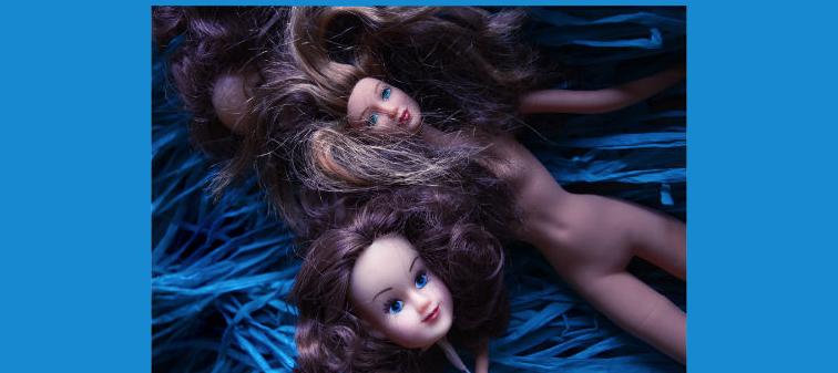 Carole Usdan Dolls on Blue Hula Skirt, Photography, 2010. Image courtesy of the artist.