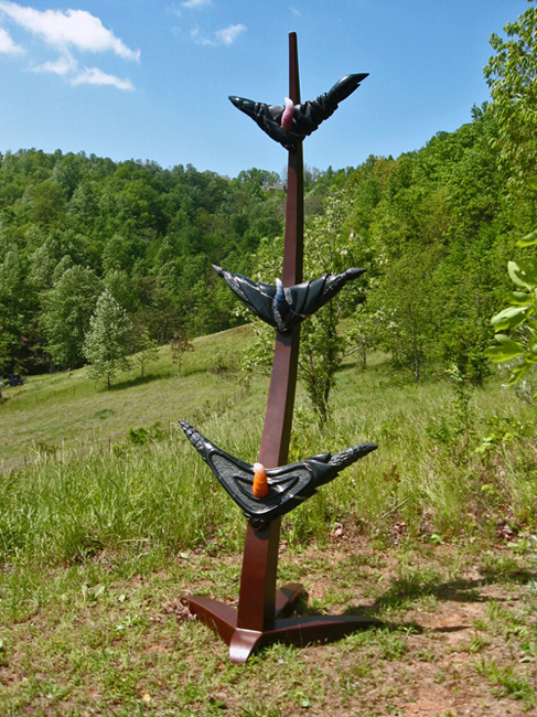 sculpture in a green field