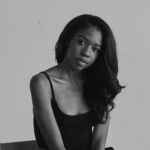 Black and white headshot of a woman wearing a tank top